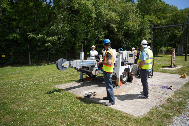 Sherman+Reilly engineering department on the test field with an electric underground puller